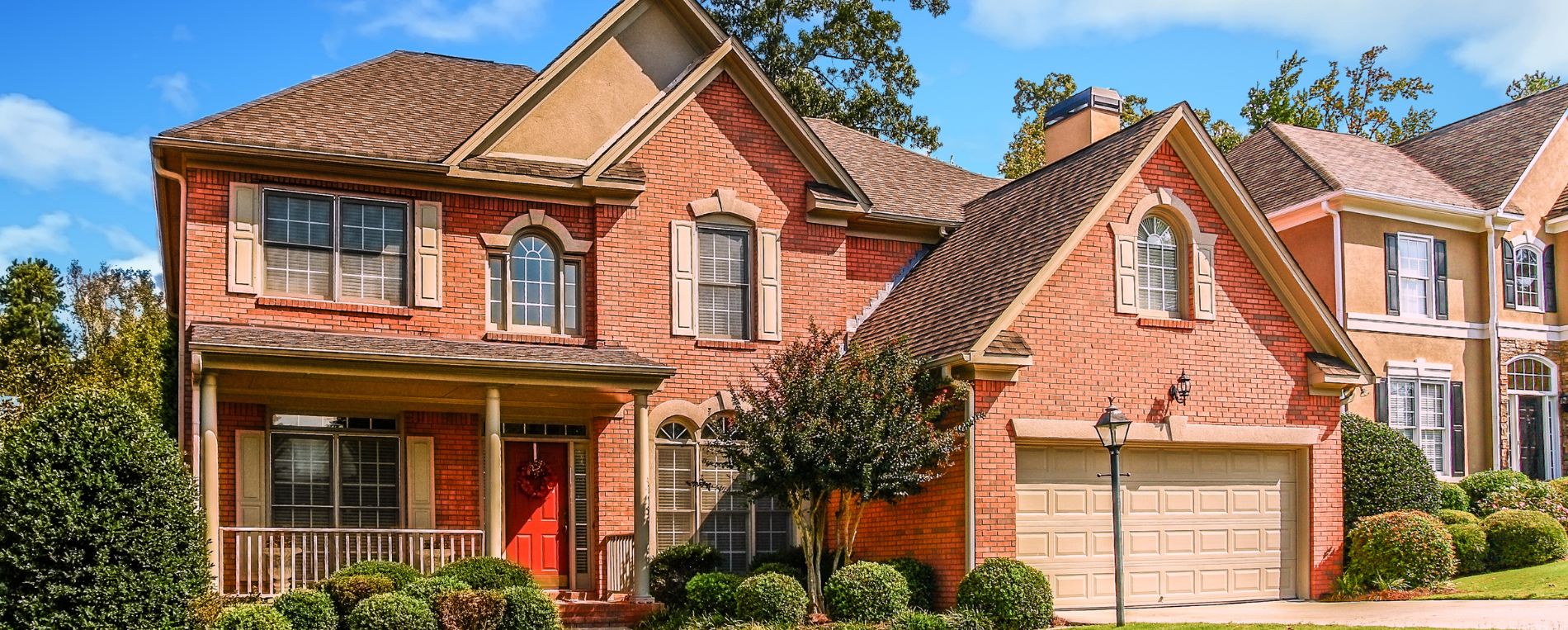 A brick house with modern garage door